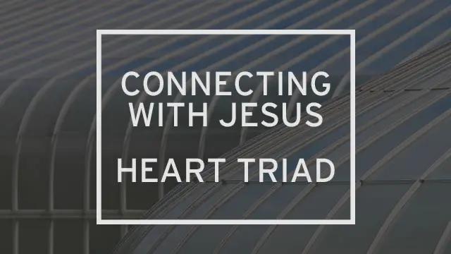 “Connecting to Jesus: Heart Triad” is written over modern glass architecture.